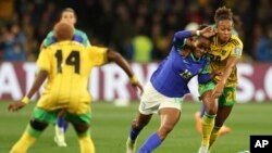 Brazil's Geyse, center, in action against Jamaica's Atlanta Primus during the Women's World Cup Group F soccer match between Jamaica and Brazil in Melbourne, Australia, Aug. 2, 2023.