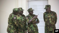 Members of a U.N.-backed Kenyan force stand at police headquarters ahead of a press conference in Port-au-Prince, Haiti, July 8, 2024.