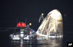 SpaceX Dragon Endurance spacecraft shortly after it landed with NASA astronaut Jasmin , Andreas Mogensen, Japan Aerospace Satoshi Furukawa, and Russia cosmonaut Konstantin Borisov aboard in the Gulf of Mexico Fla., Tuesday, March 12, 2024. (Joel Kowsky/NASA via AP)