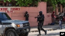 Police stop at a car to inspect in Port-au-Prince, Haiti, April 22, 2024. 