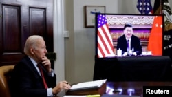 FILE - U.S. President Joe Biden speaks with Chinese leader Xi Jinping from the White House in Washington, Nov. 15, 2021. The two spoke again July 28, 2002, amid tensions over a proposed visit to Taiwan by U.S. House Speaker Nancy Pelosi.