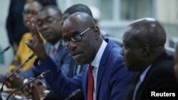 Haiti's Minister of Planning and External Cooperation Aviol Fleurant gestures as he speaks during a news conference about the resolution on the Oxfam scandal in Port-au-Prince, Haiti, June 13, 2018. 