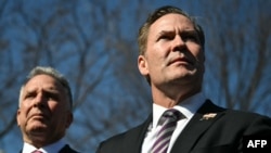 (L-R) US Special Envoy to the Middle East Steve Witkoff and US National Security Advisor Mike Waltz speak to reporters outside the White House on February 4, 2025, in Washington, DC.