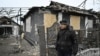 Borys Trymbytsky, 62, stands in front of his house damaged following a Russian airstrike in the town of Bilytske, near Pokrovsk in the Donetsk region on January 16, 2025, amid the Russian invasion of Ukraine.