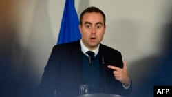 FILE - French Defense Minister Sebastien Lecornu addresses a press conference after a meeting at the Defense Ministry in Berlin on Nov. 25, 2024. 