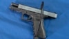 FILE - A Glock 17 pistol fitted a with a cable style gun lock in Philadelphia, May 10, 2023. 