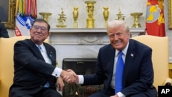 President Donald Trump meets with Japanese Prime Minister Shigeru Ishiba in the Oval Office of the White House, Feb. 7, 2025, in Washington. 