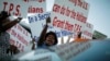 Members of the Haitian community shout slogans in favor of the Temporary Protected Status (TPS) for Haitian immigrants during a visit by U.S. President Barack Obama to Miami, Florida, October 26, 2009. REUTERS/Carlos Barria (UNITED STATES CONFLICT POLI