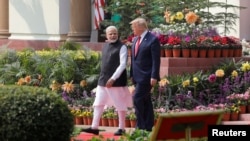 FILE PHOTO: FILE PHOTO: U.S. President Donald Trump and India's Prime Minister Narendra Modi arrive for their joint news conference at Hyderabad House in New Delhi