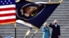 President Joe Biden salutes as his wife Jill puts her hand over her heart as they review the troops from the steps of the U.S. Capitol during the inauguration, Wednesday, Jan. 20, 2021, in Washington. (David Tulis/Pool Photo via AP)