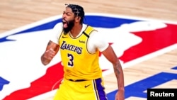 Oct 6, 2020; Miami, Florida, USA; Los Angeles Lakers forward Anthony Davis (3) celebrates after making a three pointer during the fourth quarter against the Miami Heat in game 4 of the 2020 NBA Finals at AdventHealth Arena. Mandatory Credit: Kim Klement-U