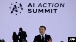 France's President Emmanuel Macron delivers a speech during a closing event for the first day of the Artificial Intelligence (AI) Action Summit, at the Grand Palais, in Paris, on February 10, 2025. (Photo by Ludovic MARIN / AFP)