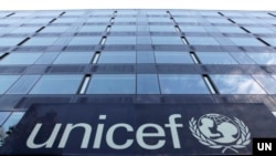 The UNICEF logo is pictured on a building in Geneva