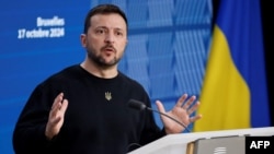 Ukraine's president Volodymyr Zelensky gives a press conference on the sideline of a EU summit in Brussels, on October 17, 2024. (Photo by Ludovic MARIN / AFP)