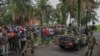 Members of the M23 armed group arrive in a pickup truck at the compound where residents gather for a protest against the Congolese government, expressing support for the M23 armed group in Goma on January 31, 2025.