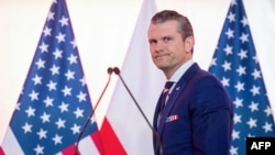 (FILES) US Defence Secretary Pete Hegseth arrives for a join press conference with Poland's Defence Minister Wladyslaw Kosiniak-Kamysz (not pictured) at the Ministry of Defence headquarters in Warsaw on February 14, 2025.