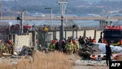 Rescue personnel work at the scene where a Jeju Air Boeing 737-800 series aircraft crashed and burst into flames at Muan International Airport in South Jeolla Province, some 288 kilometres southwest of Seoul on December 29, 2024.