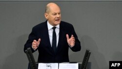 German Chancellor Olaf Scholz gives a speech during a session on November 13, 2024 at the Bundestag (lower house of parliament) in Berlin, following the breakdown of his three-party coalition.