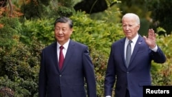 FILE PHOTO: U.S. President Joe Biden meets with Chinese President Xi Jinping on the sidelines of APEC summit, in Woodside