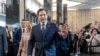 Secretary of State Marco Rubio greets people as he arrives to speak to State Department staff followed by his family, at the State Department, Jan. 21, 2025, in Washington. 