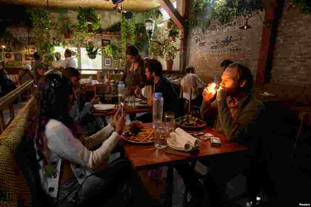 Customers smoke at Lowell Farms, America&#39;s first official Cannabis Cafe offering farm-to-table dining and smoking of cannabis in West Hollywood, California, Oct. 1, 2019.